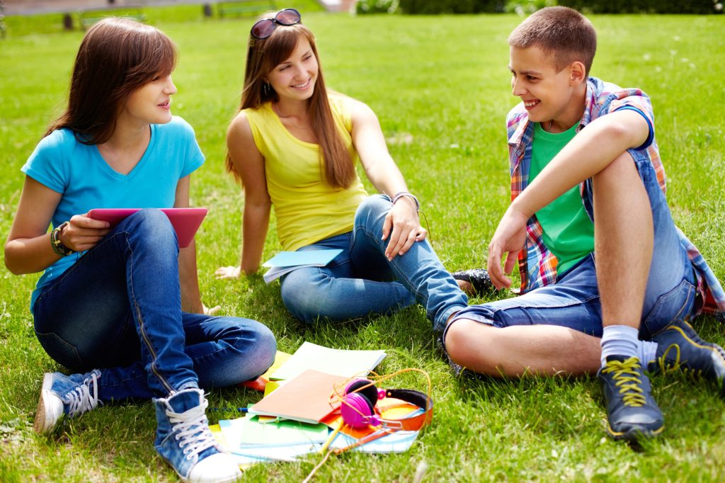 Teens talking with each other during session by Children’s and Teen’s Therapy Services