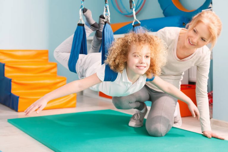 young girl exercising with Childrens And Teens Therapy Services occupational therapist